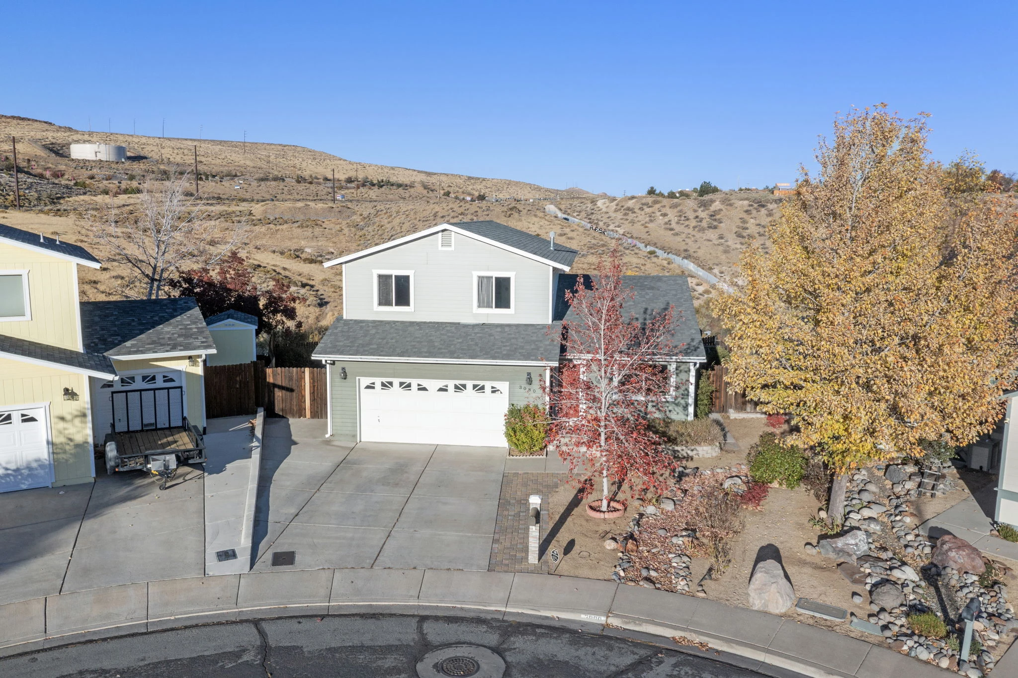 3080 Severn Drive with autumn trees and open hills behind the home